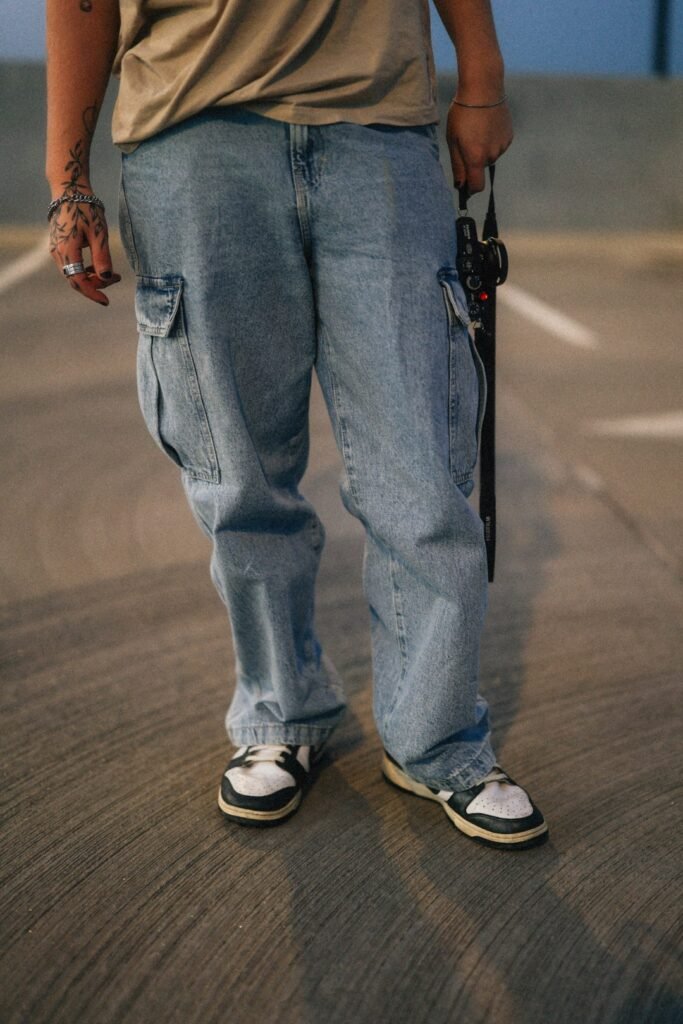 Model styling loose-fit washed denim jeans