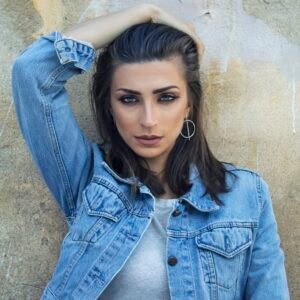 Woman styling a denim jacket