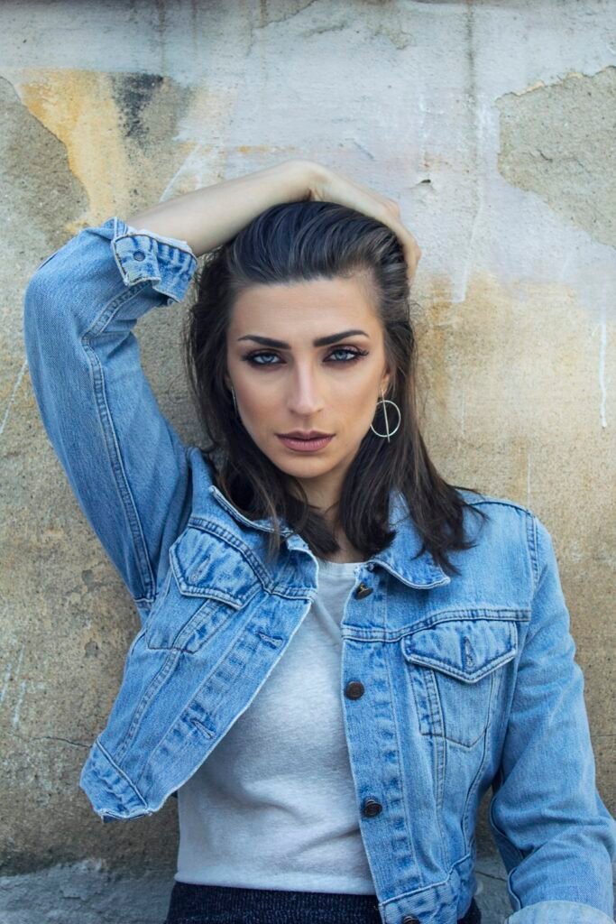Woman styling a denim jacket