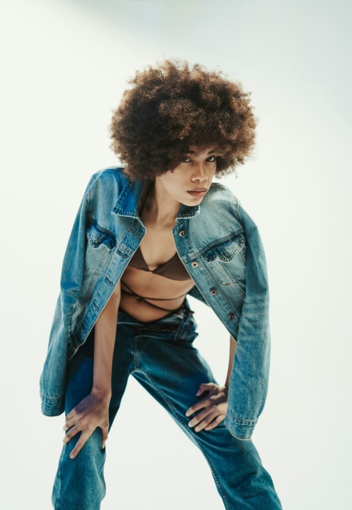 Woman wearing a casual denim and shirt outfit